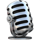 A vintage-style silver microphone with black grille openings, shown at a slight angle, sitting on a small round base.